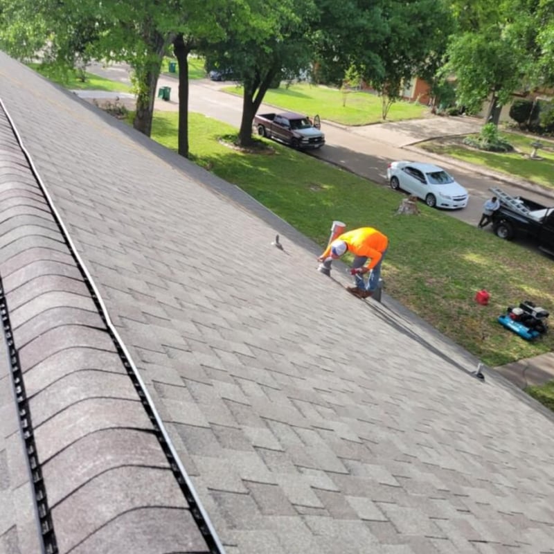 After photo of a Dallas, TX home with a complete roof rebuild featuring fresh shingles and clean lines by Tex Mex Roofing.