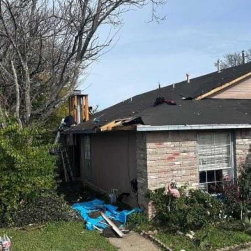 Before photo of an Austin, TX roof showing hail and wind storm damage with missing and torn shingles before restoration.