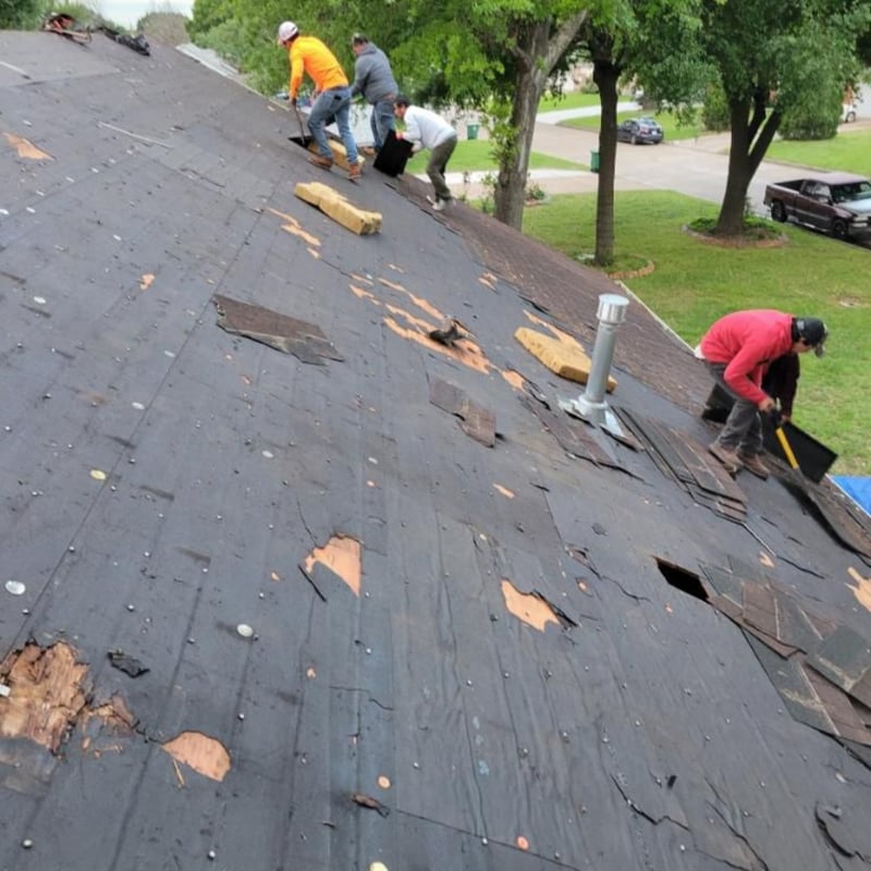 Before photo of an aged, deteriorated roof on a Dallas, TX home with curling shingles and visible wear prior to rebuild.